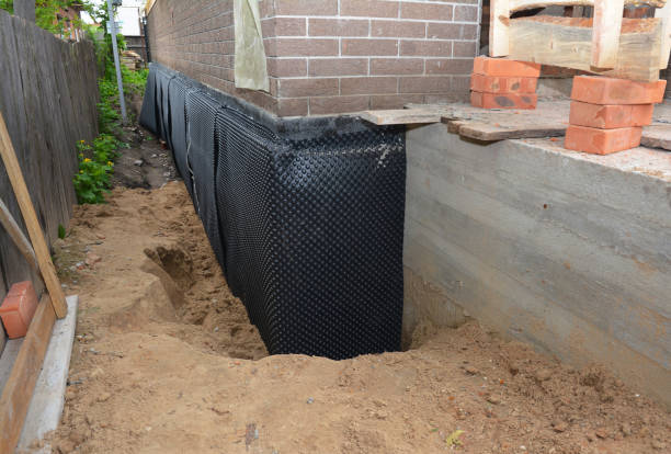 SJ Waterproofing Pros technician performing targeted Foundation Crack Repair assessment in Pomeroy, OH